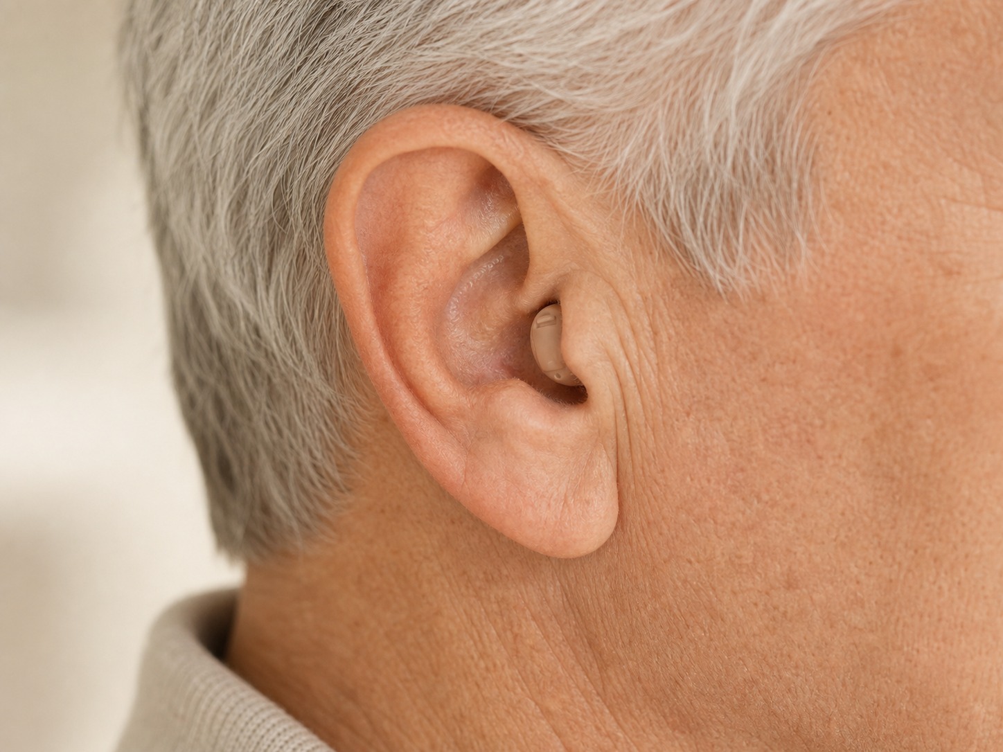 Cost Plus Invisible Hearing Aids worn in ear